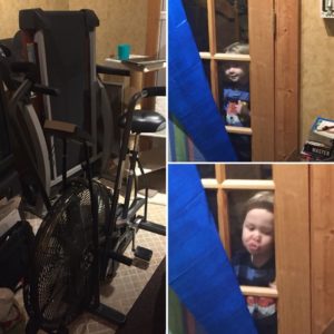 An old fanwheel exercise bike and my nephew peeking through the window at me.